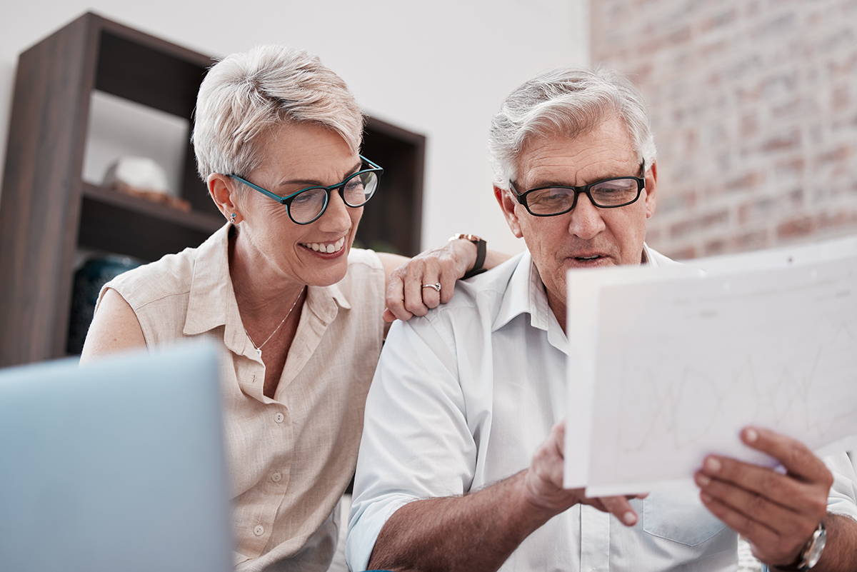 happy man and woman with document